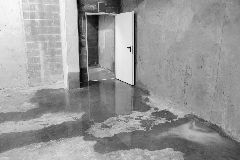 Water intrusion across a construction area showing environmental exposure risks that can delay commissioning and damage critical infrastructure in data center projects.